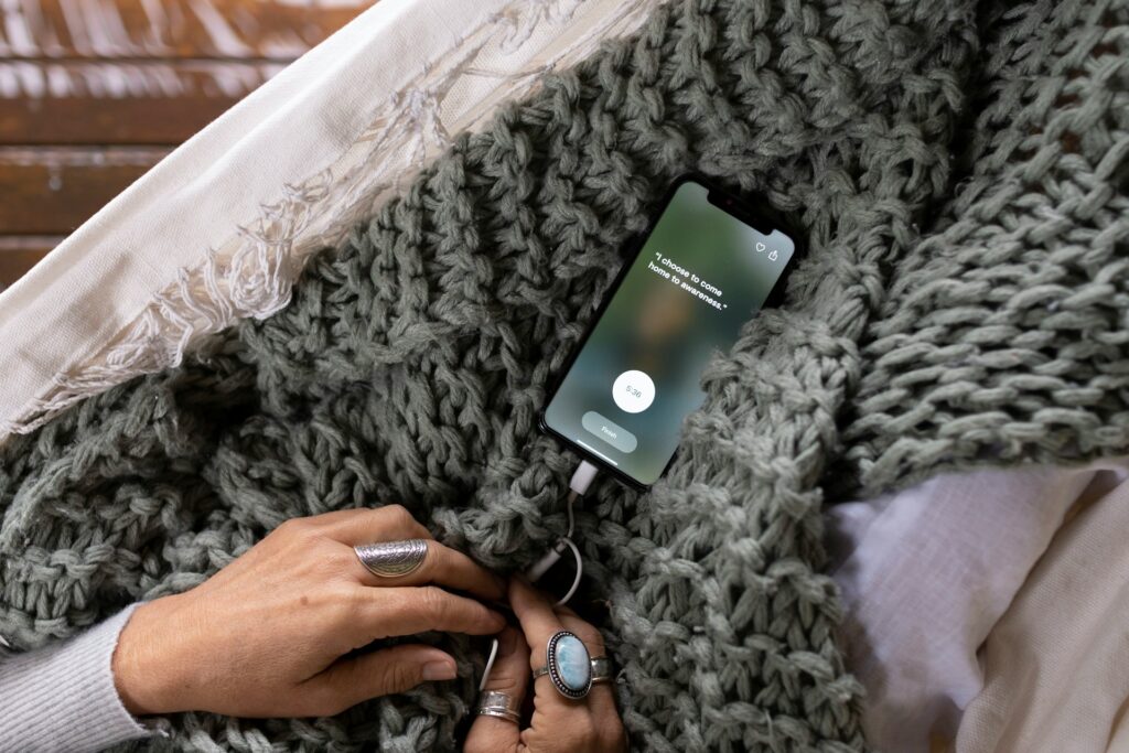The Surprising Truth About Mental Health Apps: 3 Science-Backed Benefits 4 Close-up of hands holding a smartphone displaying a mental health app with the text "I choose to come home to awareness," suggesting mindfulness or meditation.